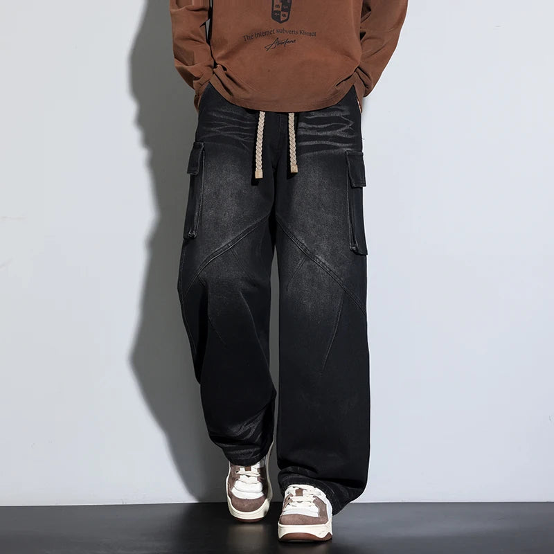 Washed blue oversized wide-leg cargo denim jeans with drawstring waist and utility pockets