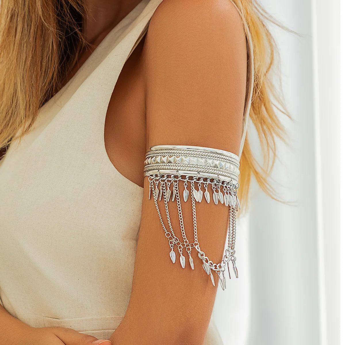 Gold armlet cuff bangle with layered chains and pyramid studs, tarnish-resistant bold statement jewelry