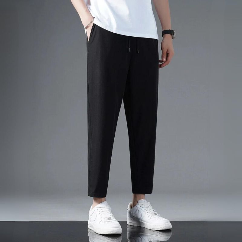 Black high-stretch activewear running pants with second-skin fit, moisture-wicking lightweight fabric