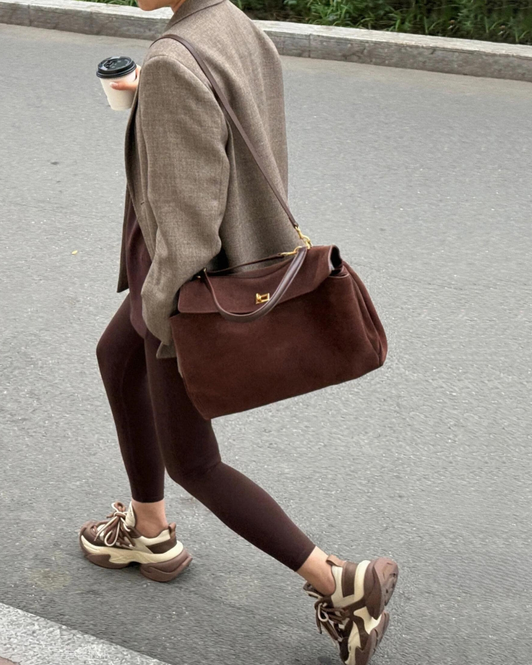 Vintage luxe tan suede top handle bag curved flap gold accents structured everyday elegance