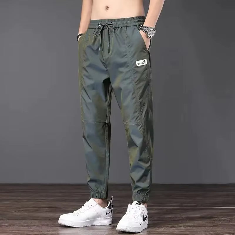 Unisex tapered nylon jogger with light-shifting gradient, lightweight breathable slim fit streetwear