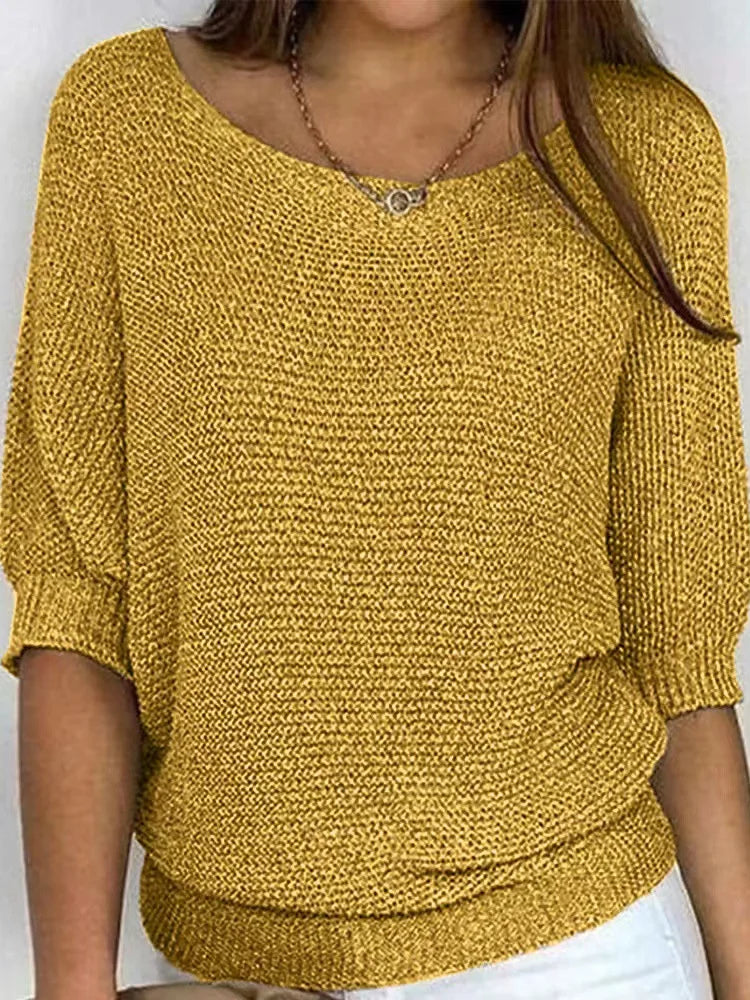 Women's cozy loose-fit knitted sweater with elbow sleeves and boat neckline for casual layering