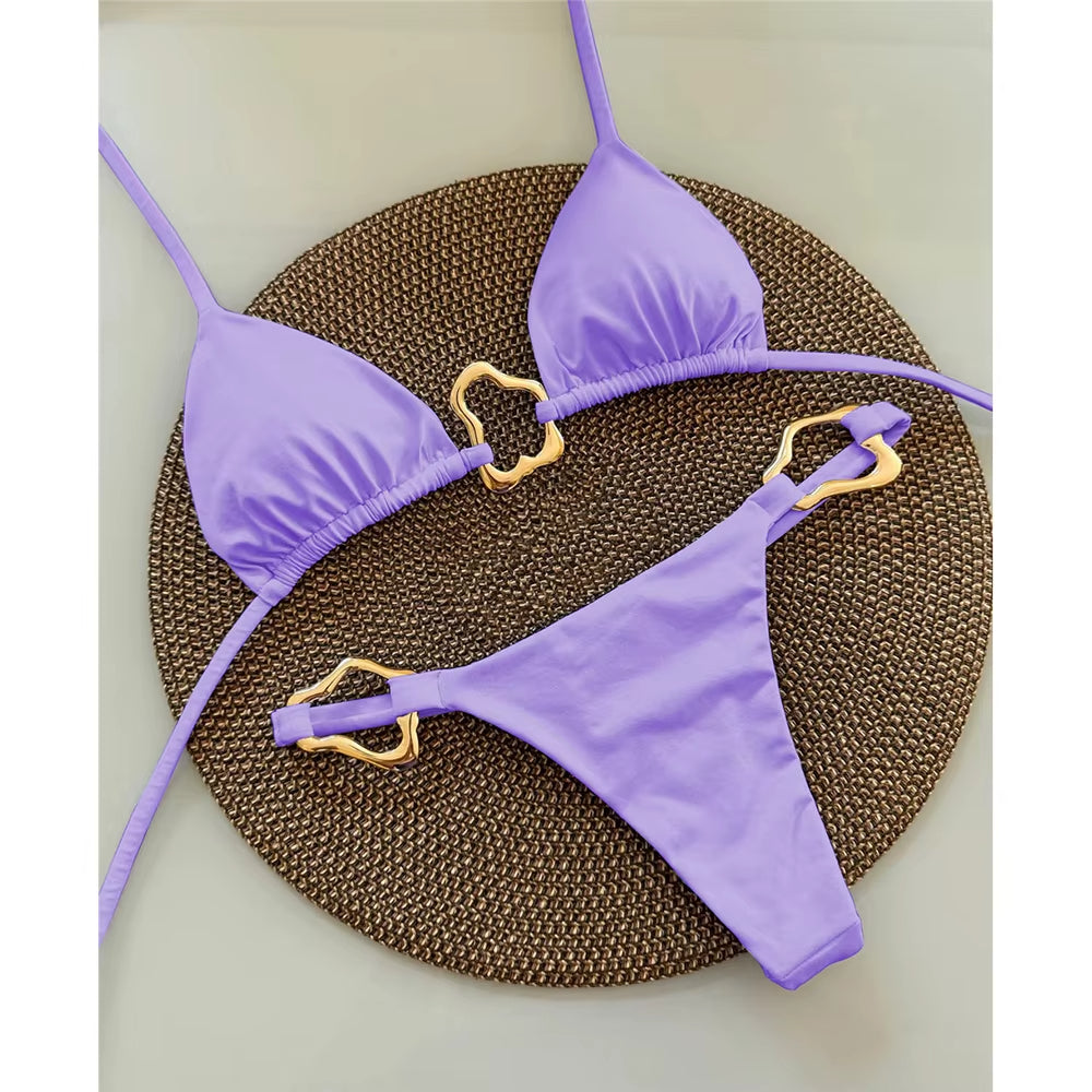 Women's gold ring accent triangle bikini set with high-cut bottoms and body-contouring adjustable ties