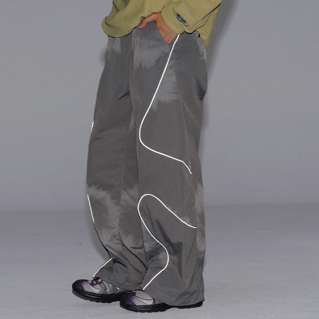 Black quick-dry nylon running trousers with curved reflective stripes and drawstring waist