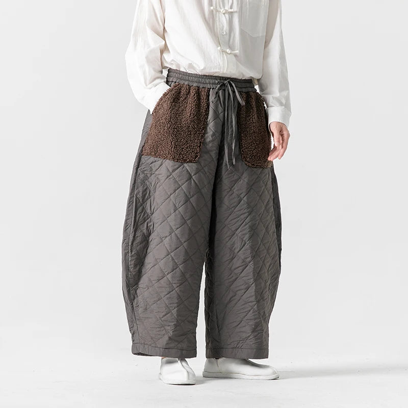 Dark fleece patch pants relaxed wide-leg silhouette quilted texture bold pockets streetwear style
