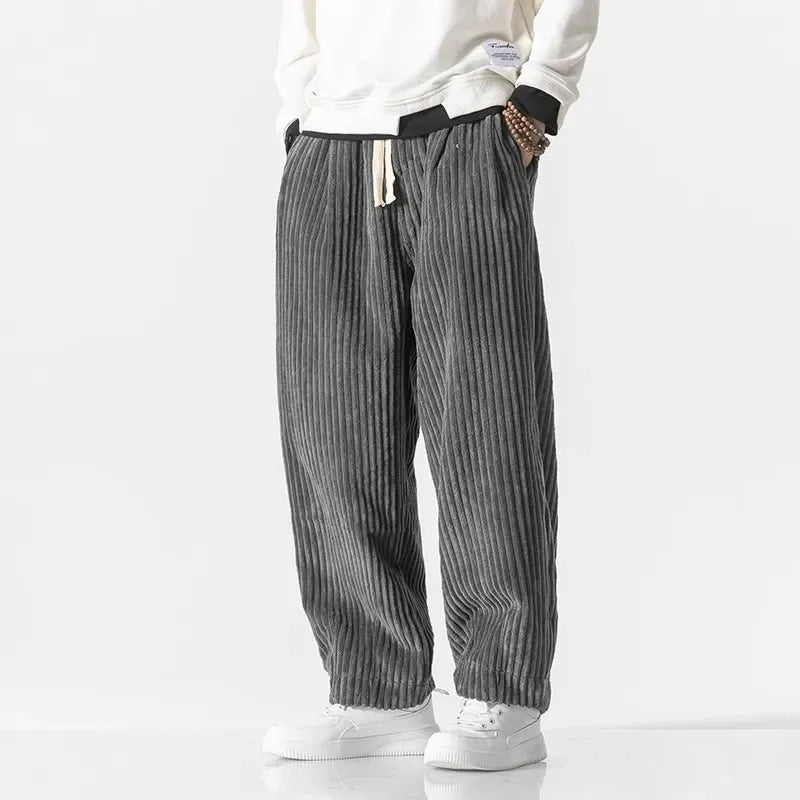 Men's oversized harem pants in neutral tone with ribbed texture and adjustable drawstring waist