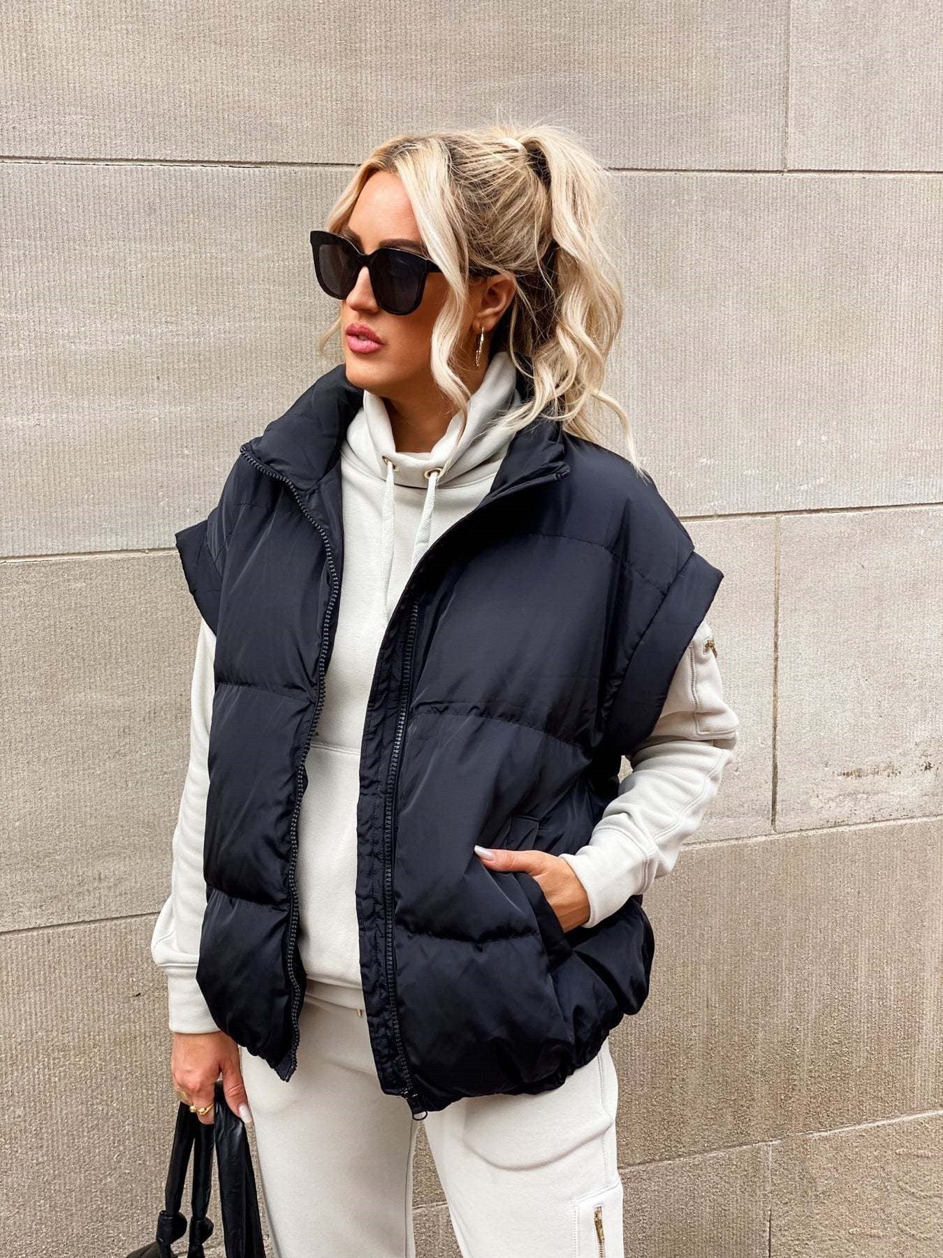 Women's padded quilted vest relaxed fit high collar zipper closure layering essential transitional outerwear
