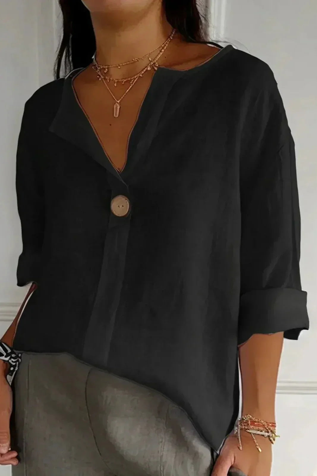 Women's relaxed blouse soft draped silhouette rolled short sleeves V-slit neckline effortless chic