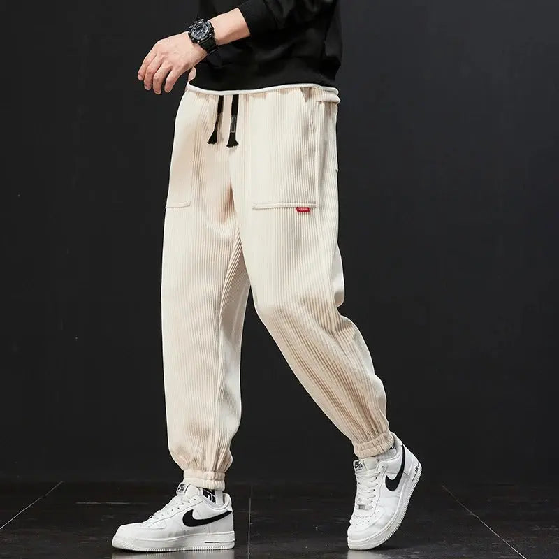 Beige corduroy sweatpants relaxed fit lounge style with adjustable waistband and deep pockets