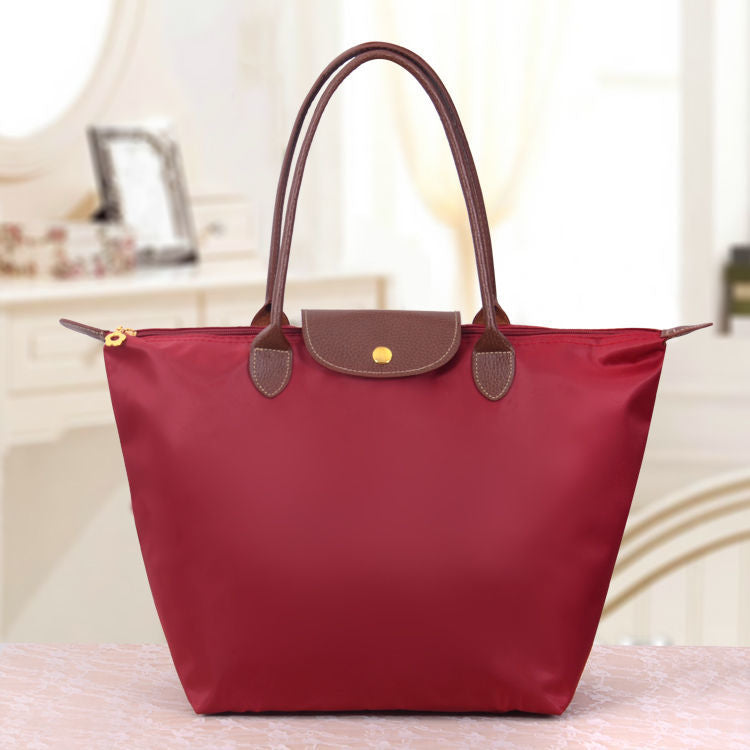 Large structured women's tote bag elegant designer shoulder bag spacious everyday carry durable