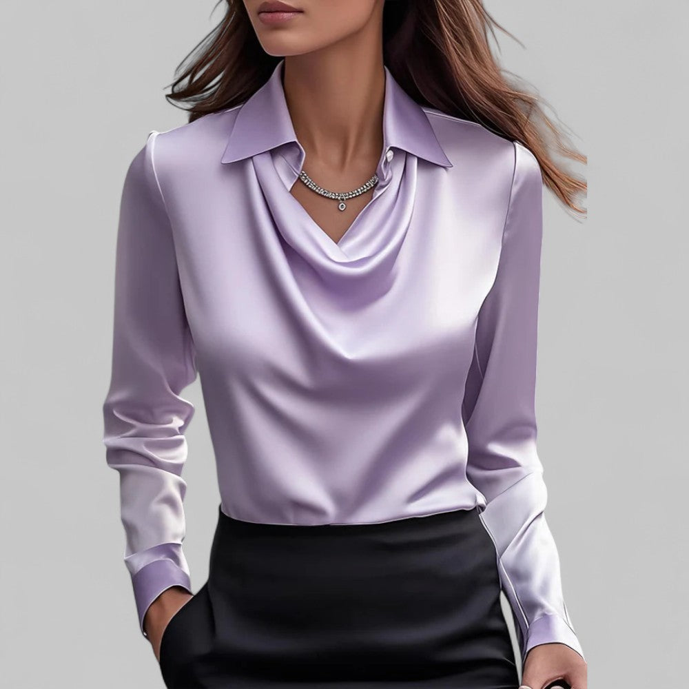 Women's ivory satin blouse with draped silhouette, structured collar, and light-catching fluid fabric