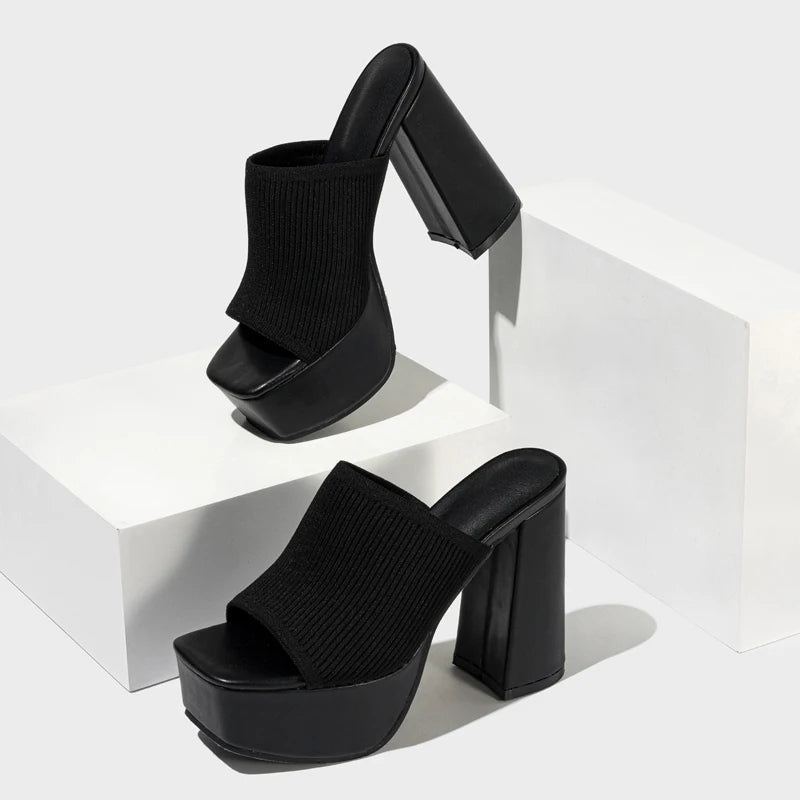 Bold neon stretch ribbed knit platform mule heel with sky-high block heel and snug fit