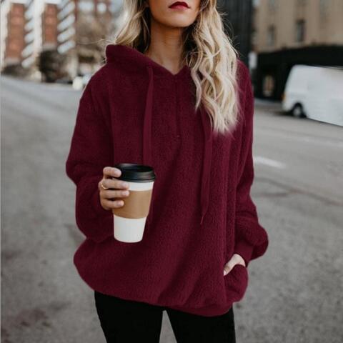 Unisex fluffy fleece hoodie in cozy soft fabric, casual streetwear style with relaxed fit for cold days