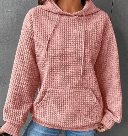 Women's loose fit hoodie with kangaroo pocket in soft textured fabric for casual everyday comfort