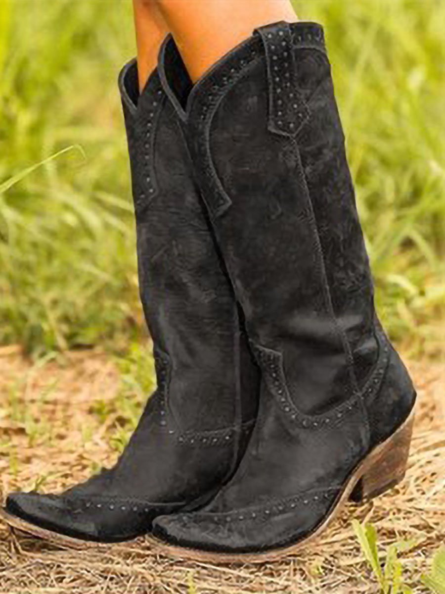 Brown vintage cowgirl boots with low heel, studded rivet embellishments and Western-style artificial leather vamp