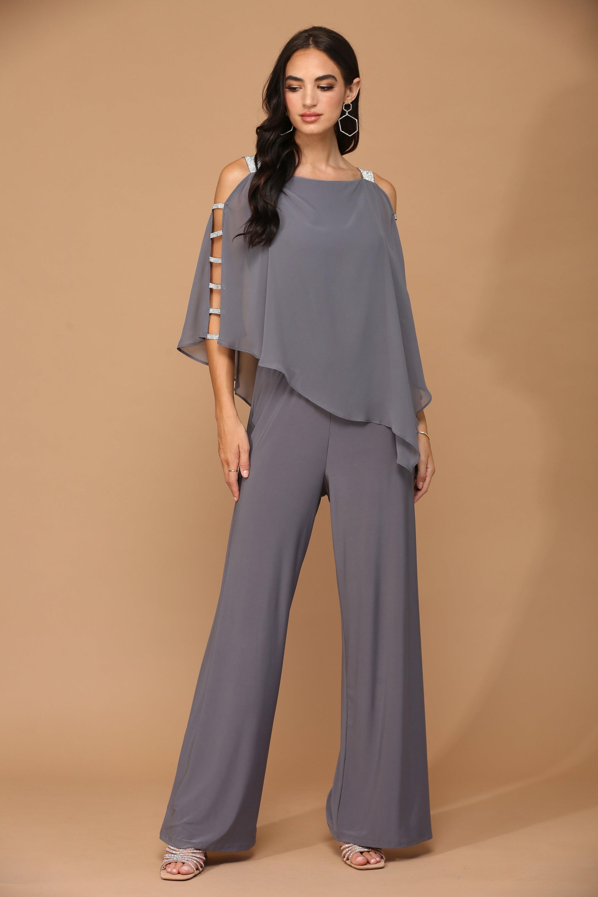 Elegant black chiffon cape overlay jumpsuit with stretch jersey base, formal wide-leg silhouette