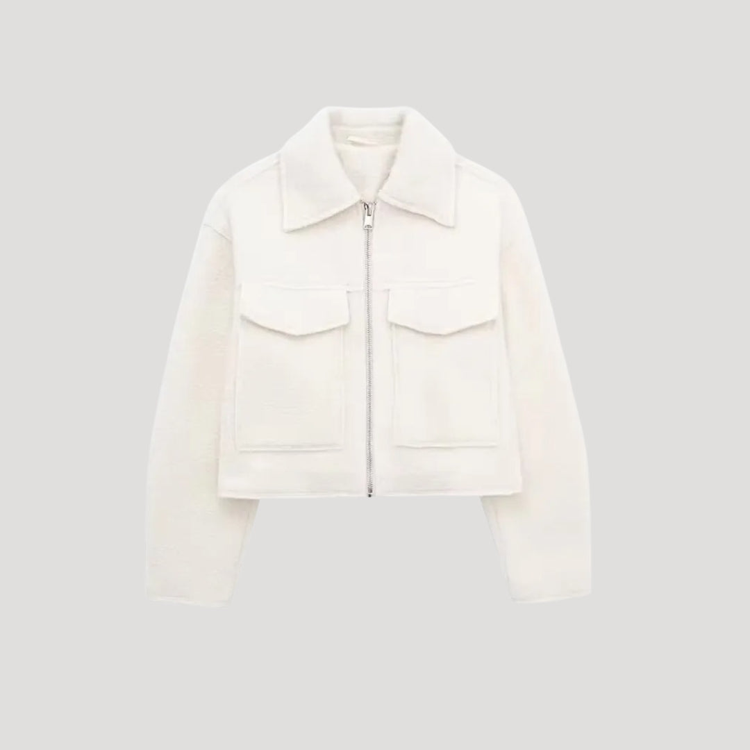 Women's cropped zip-front winter jacket in neutral tone, chic layering style with insulated warmth