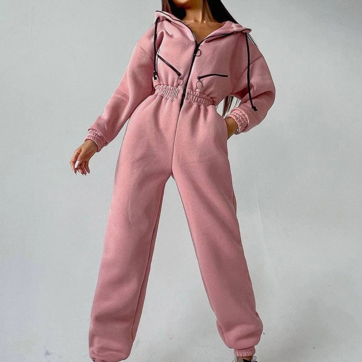 Gray heavyweight fleece zip-up jumpsuit with cinched waist, adjustable hood, and relaxed fit