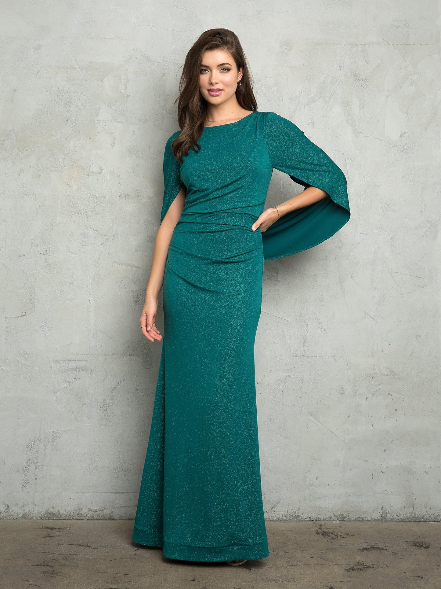 Full-length glitter jersey mother of the bride gown with cowl back, ruching, and fit-to-flare silhouette