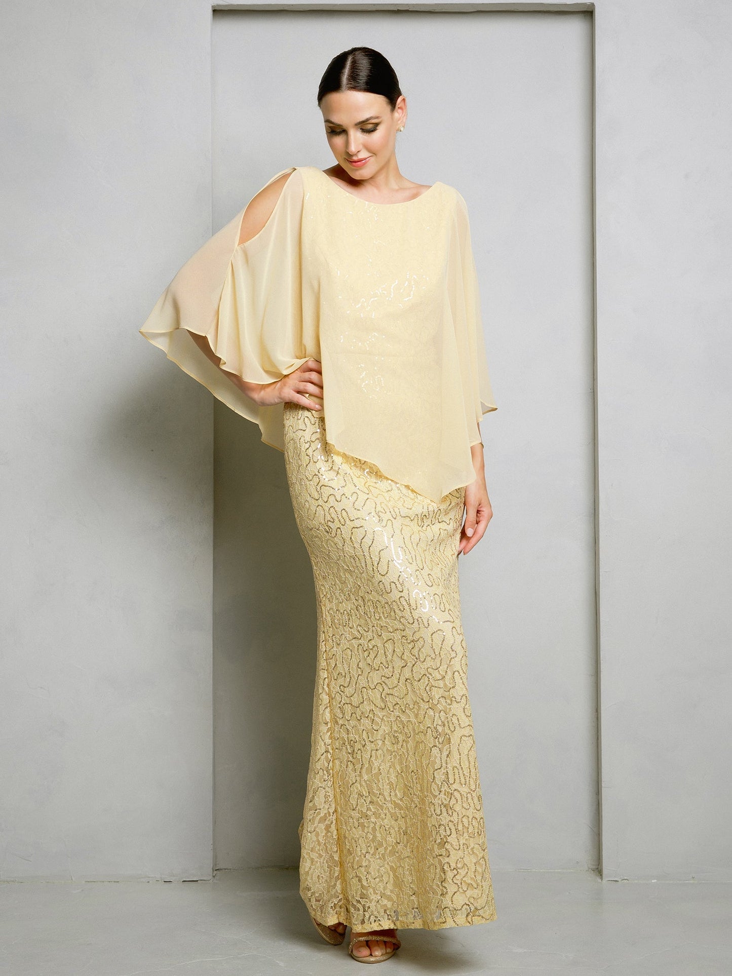Floor-length mother of the bride gown with sequin lace bodice and flowing chiffon cape overlay