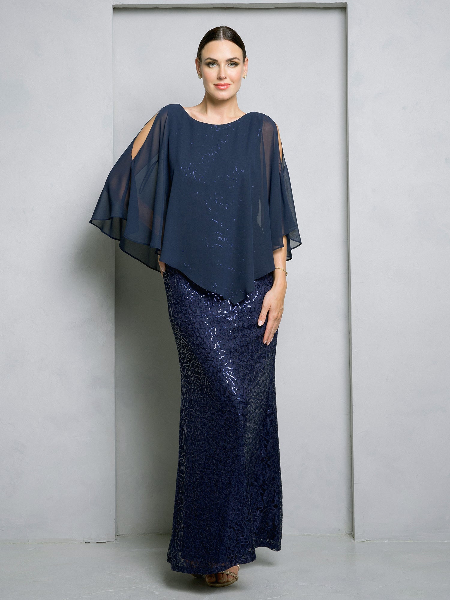 Formal floor-length mother of the bride gown with sequin lace bodice and flowing chiffon cape