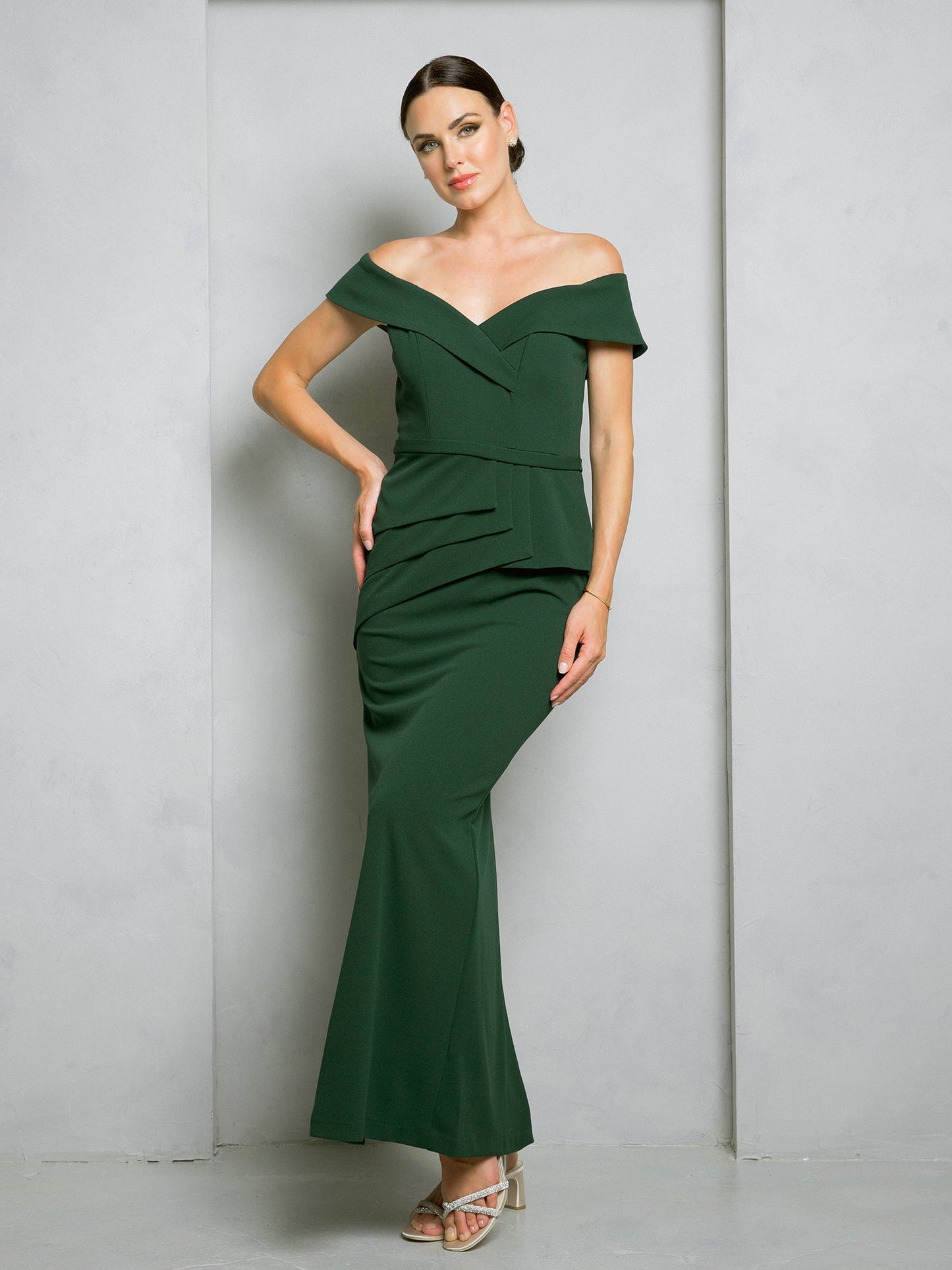 Black off-shoulder floor-length evening gown with structured bodice and elegant waist peplum