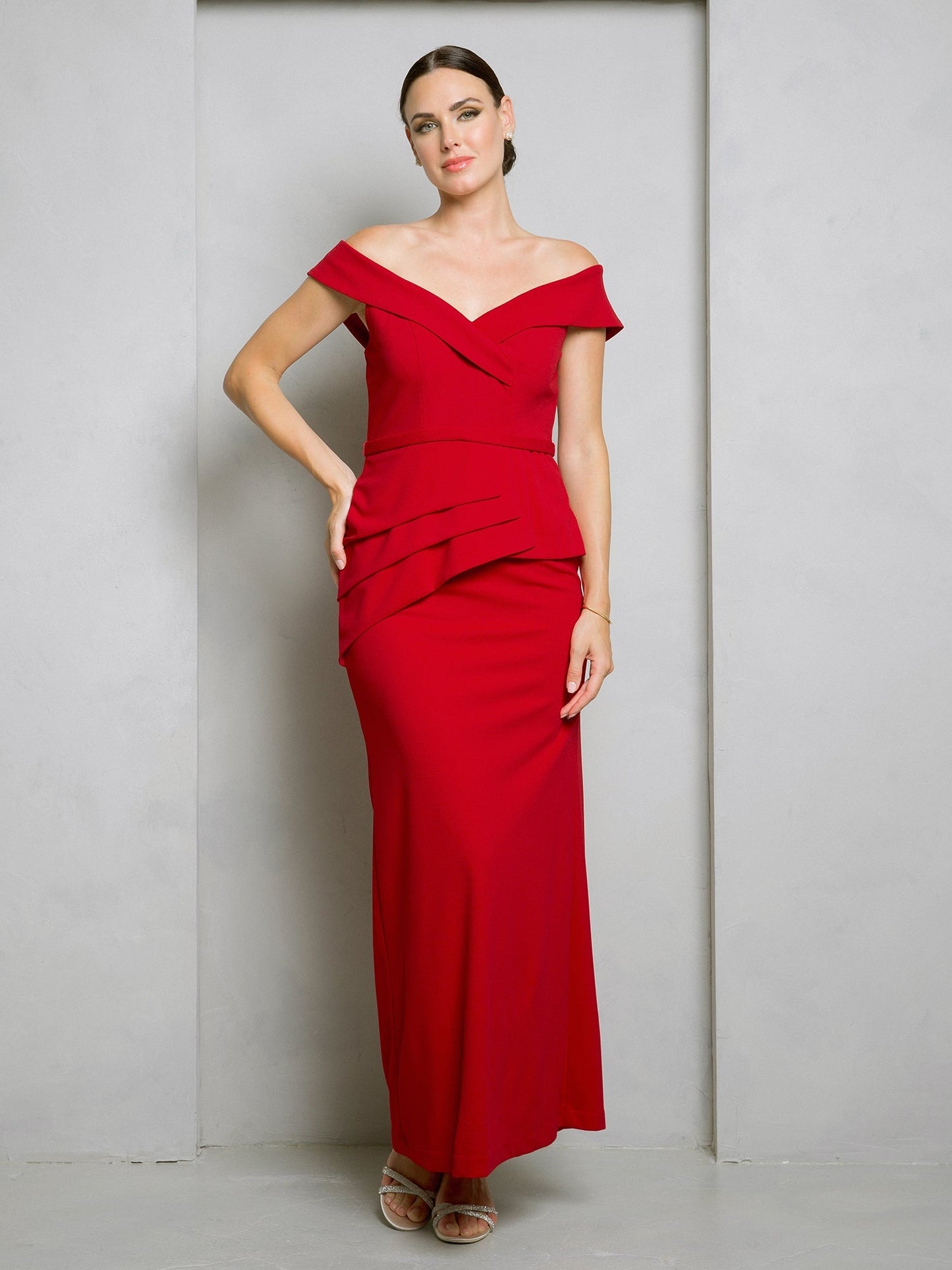 Black off-shoulder floor-length formal gown with structured bodice and waist peplum