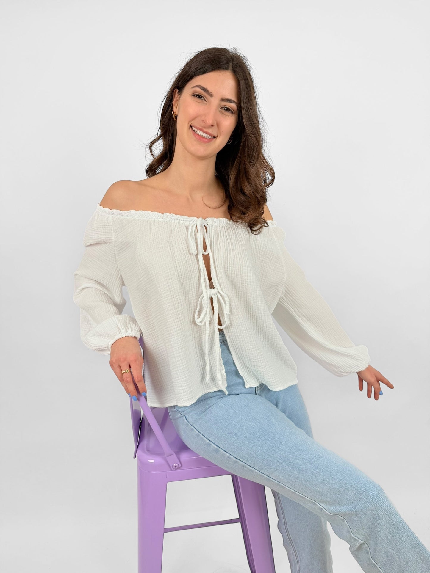 Women's white muslin blouse lightweight breathable fabric with delicate bow accents everyday elegance