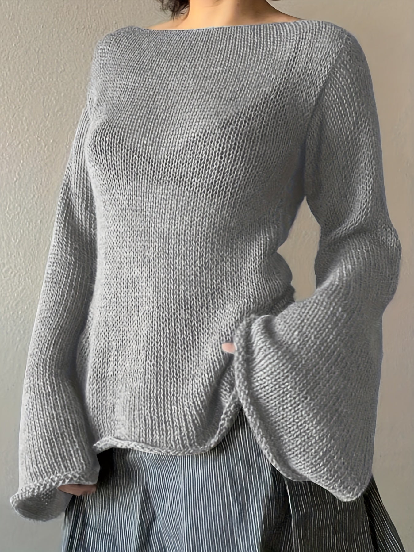 Women's beige knit sweater minimalist silhouette with elegant flared draped sleeves soft warm style