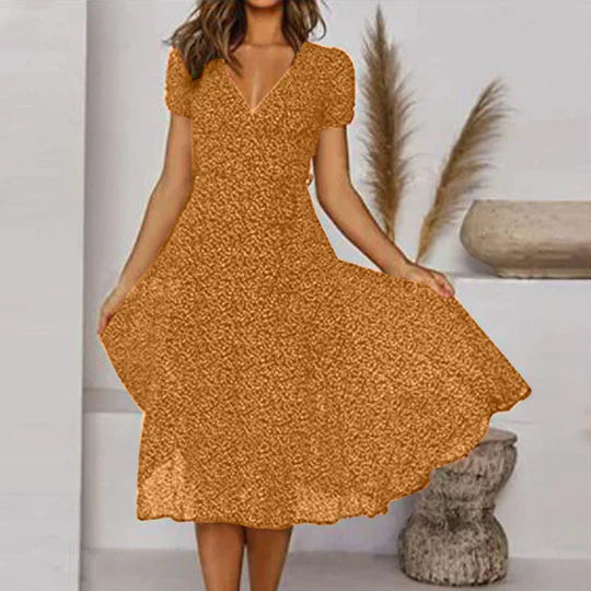 Women's black A-line dress with V-neck and flared hem, chic easy-care silhouette