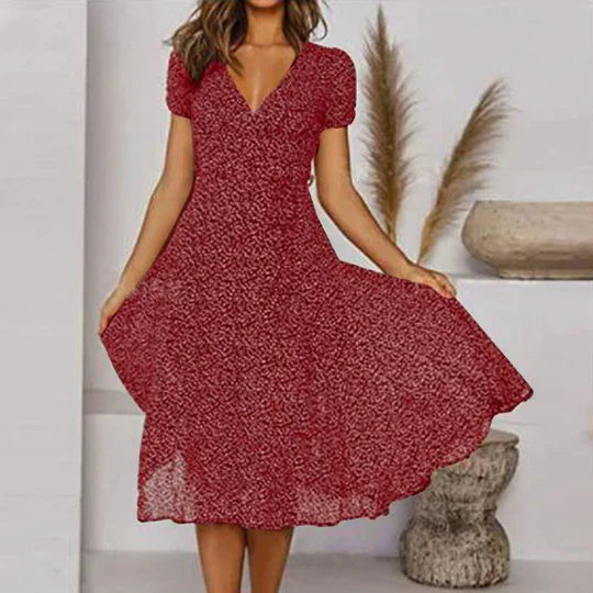 Women's black A-line dress with V-neck and flared hem, chic easy-care silhouette