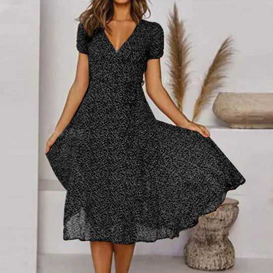 Women's black A-line dress with V-neck and flared hem, chic easy-care silhouette