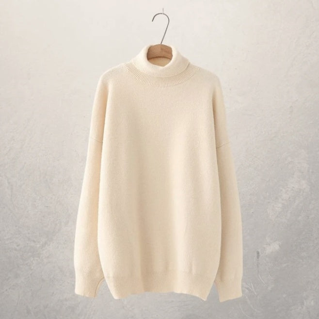 Autumn relaxed-fit turtleneck sweater in solid neutral tone with clean minimalist lines for everyday wear