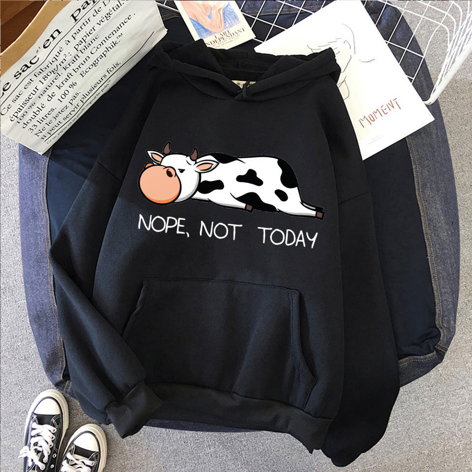 Women's relaxed fit hoodie with funny sleeping cow print and "Nope Not Today" graphic in cozy style
