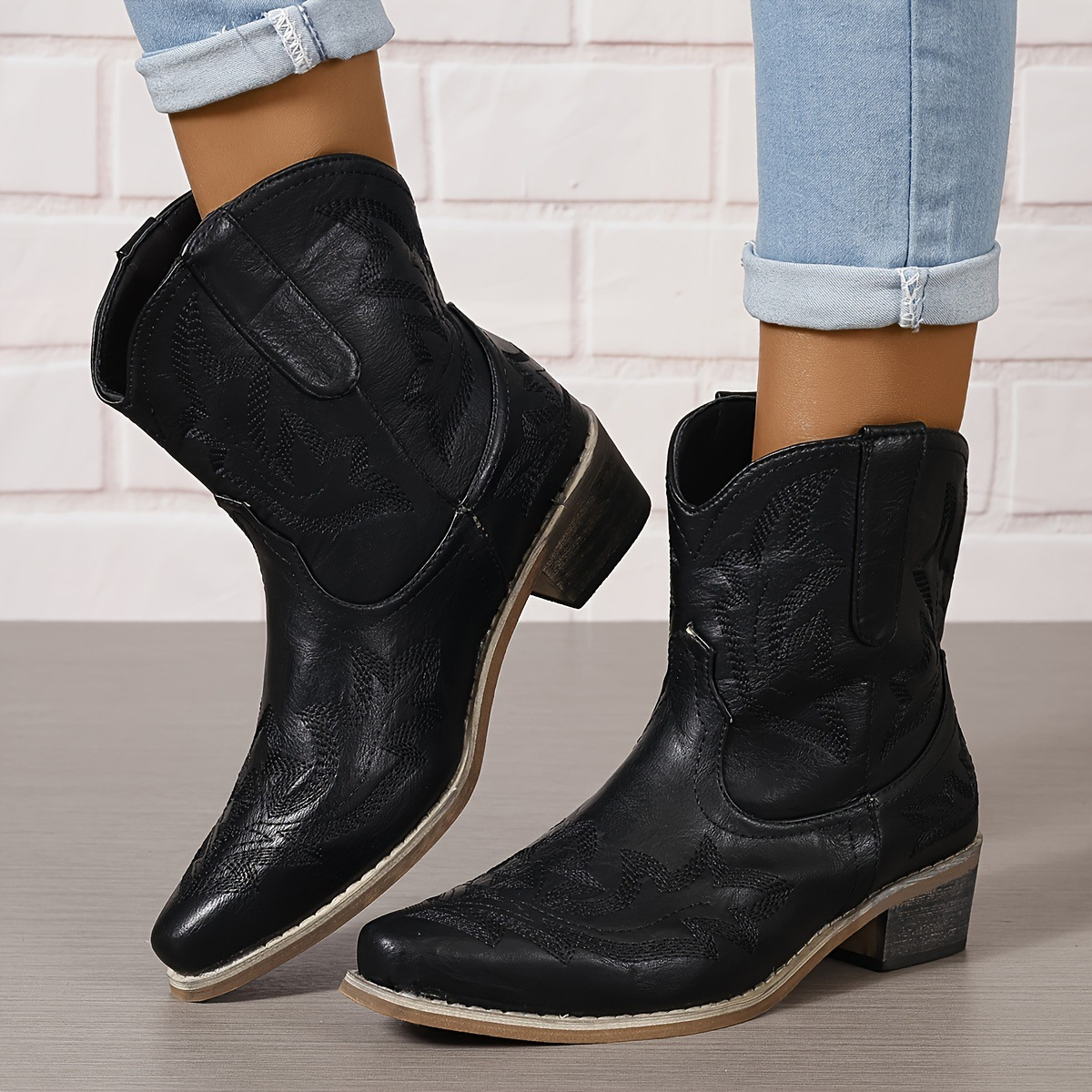 Women's vintage western ankle boots in brown with floral embroidery, block heel, and studded buckle straps