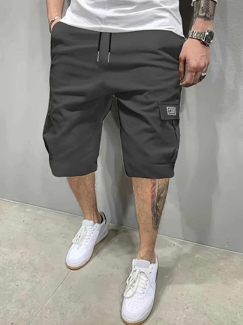 Men's palm tree graphic shorts in vibrant tropical print, relaxed comfort fit for beach and summer wear