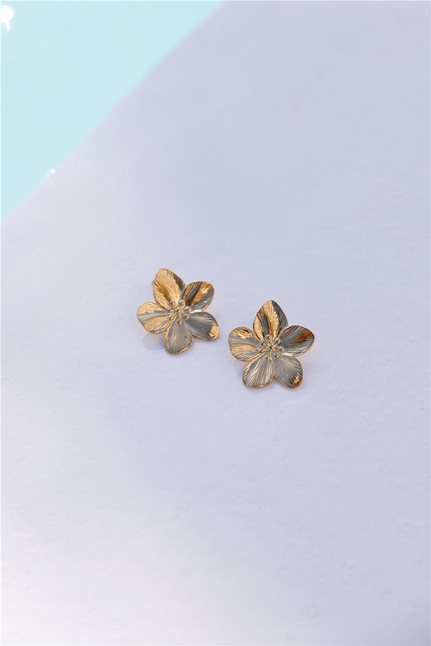 18k gold plated flower stud earrings with polished finish and bold feminine floral motif