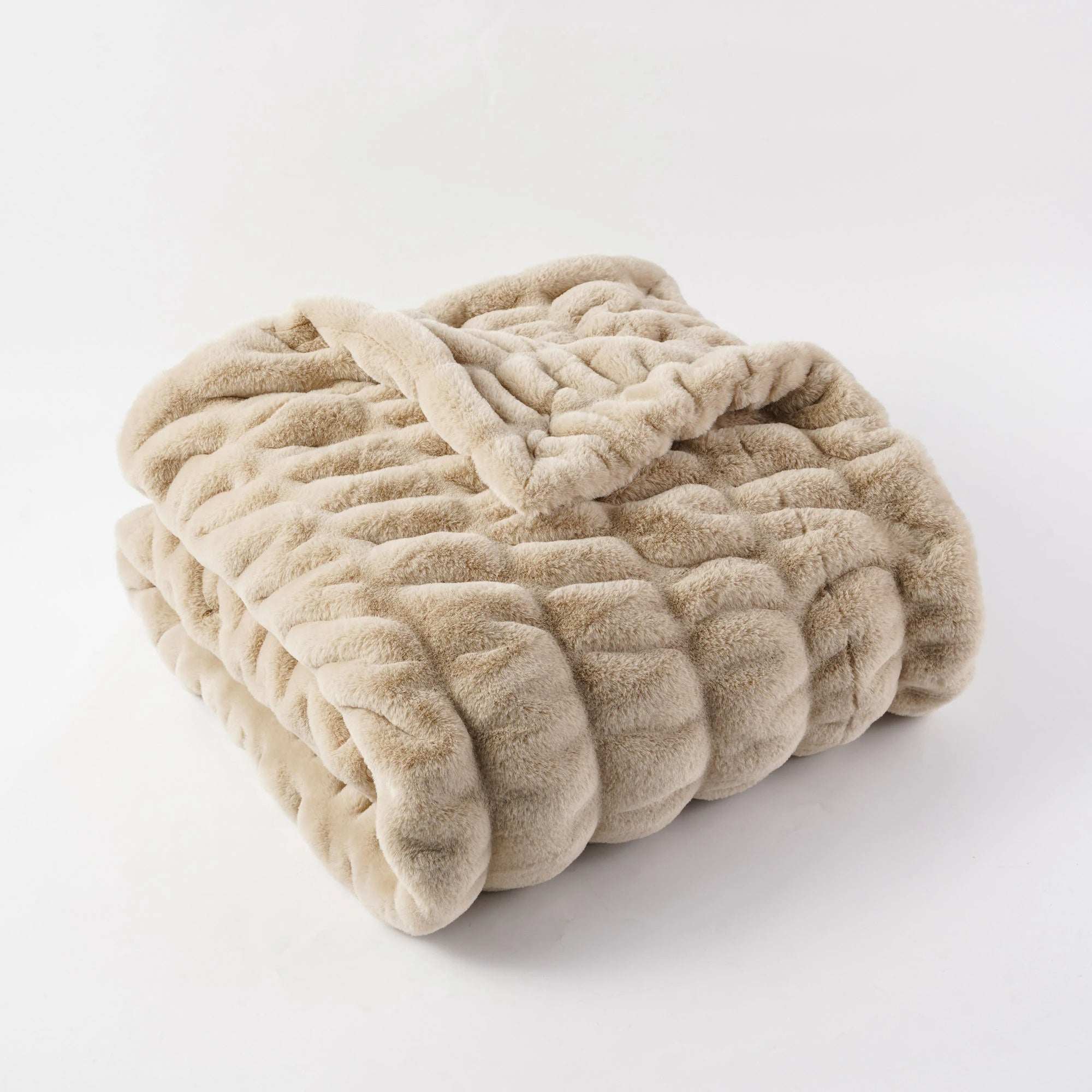 Ultra-soft faux rabbit fur throw blanket in plush textured quilted design for modern living room decor