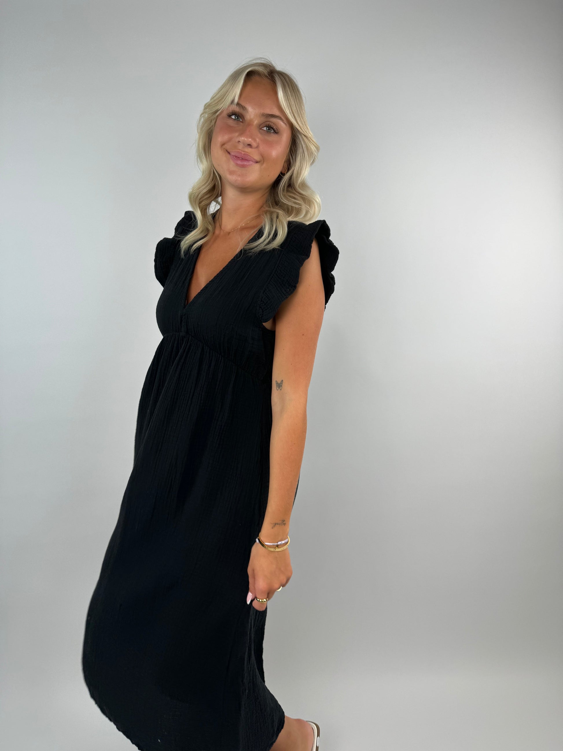 Pia white muslin midi dress elegant flowing silhouette with delicate ruffles for special occasions