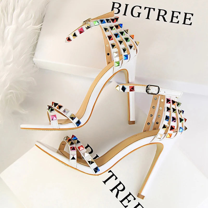 Metallic leather stiletto with pyramid studs, triple straps, pointed toe, sculpted heel for nightlife glam