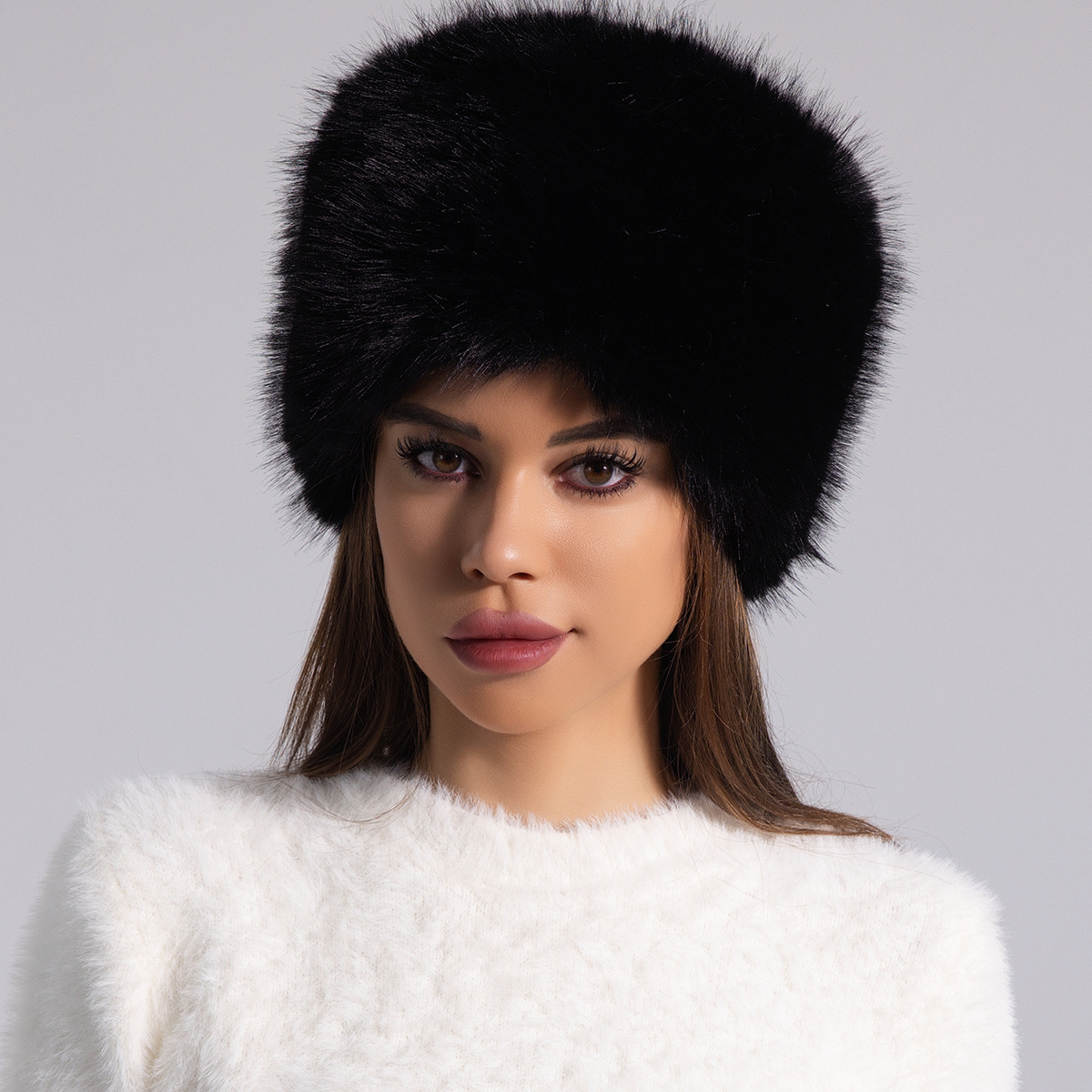 Women's round fur hat in plush ivory white, full-coverage winter style with luxurious furry texture