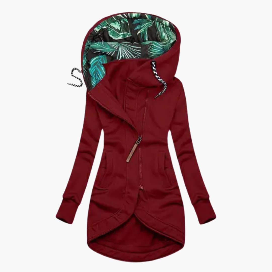 Women's quilted winter jacket with fixed hood, raised neckline, and large front pockets for cozy warmth