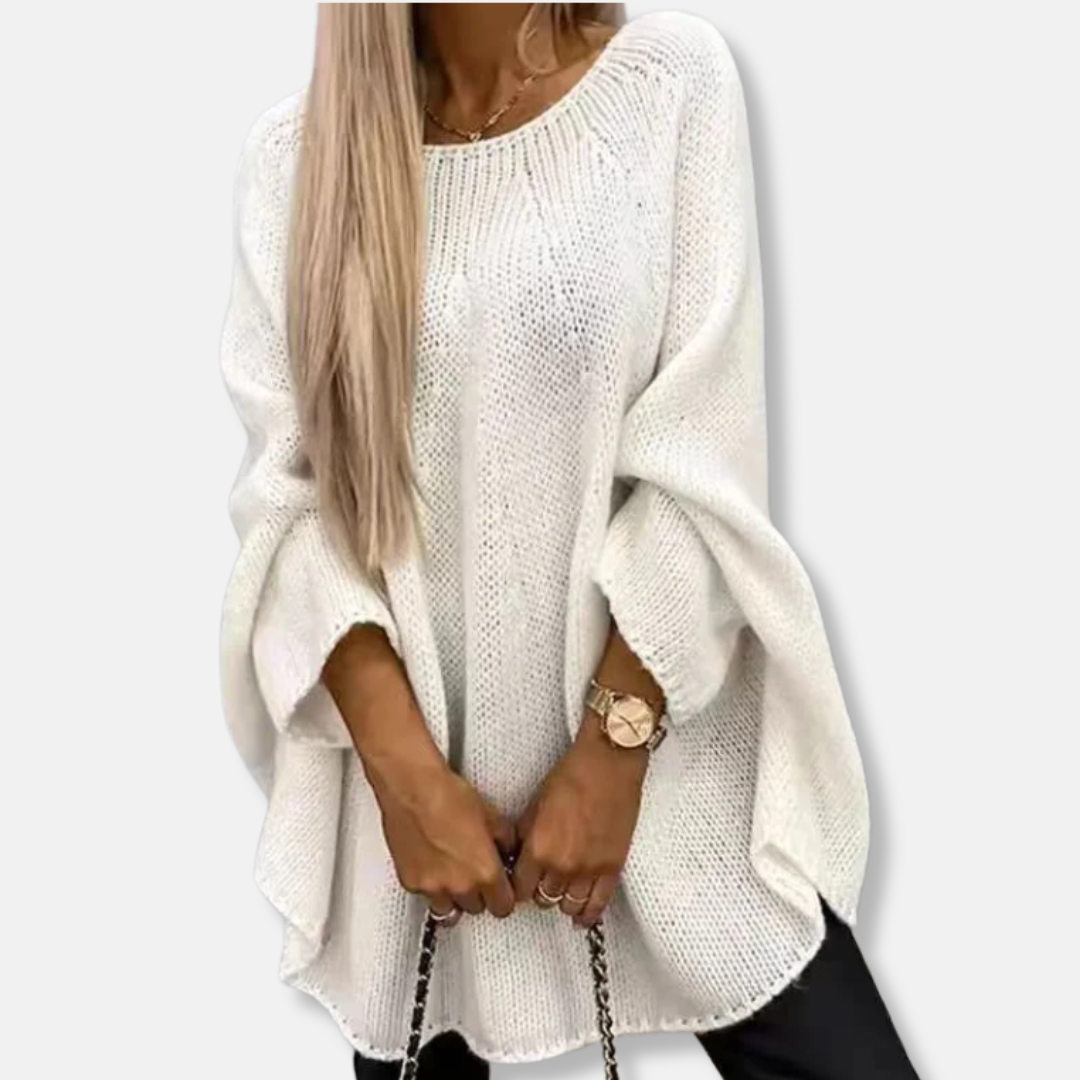 Women's chunky knit oversized tunic sweater in neutral tone with relaxed batwing sleeves