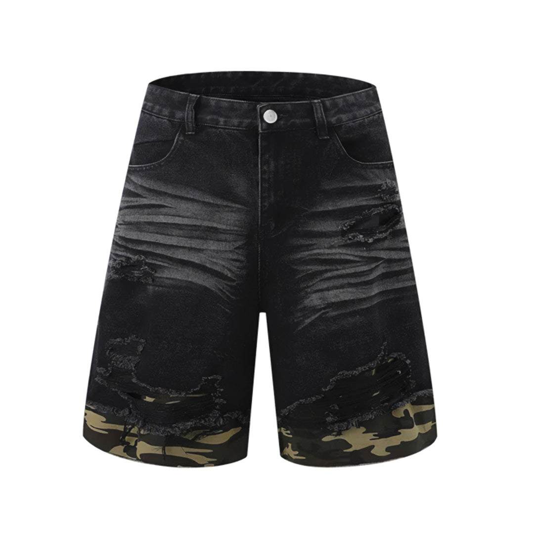 Faded light wash denim shorts with camouflage panels, relaxed fit, and distressed shredded hems for streetwear