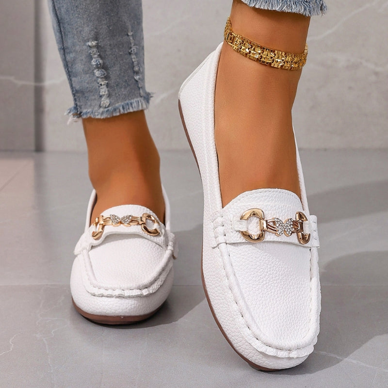 Women's slip-on loafers with round toe, subtle gold hardware, and classic silhouette for effortless everyday style
