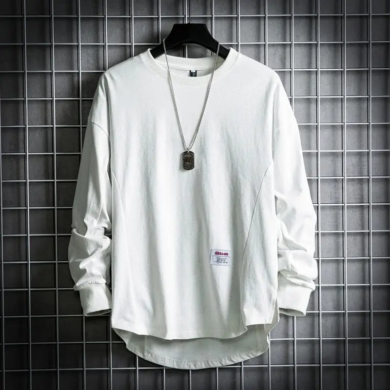 Oversized cream cotton crewneck pullover with drop hem, relaxed fit, unisex everyday layering essential