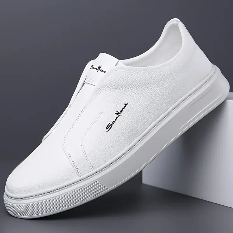 White vegan leather slip-on sneakers minimalist silhouette with cushioned insole everyday comfort