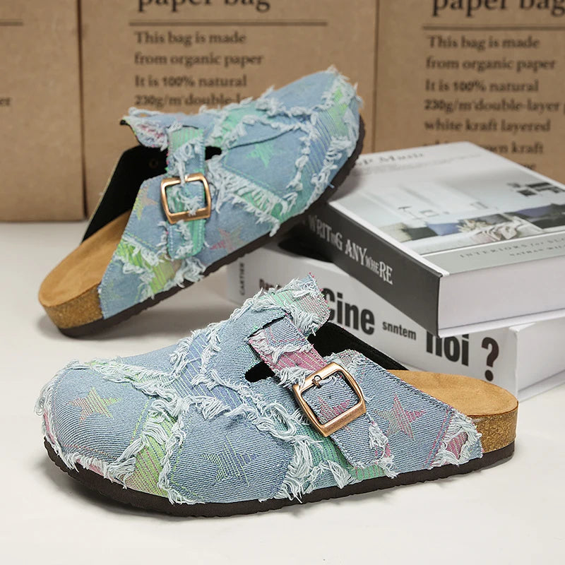 Women's distressed denim mules with patchwork texture, star details, and cork footbed comfort