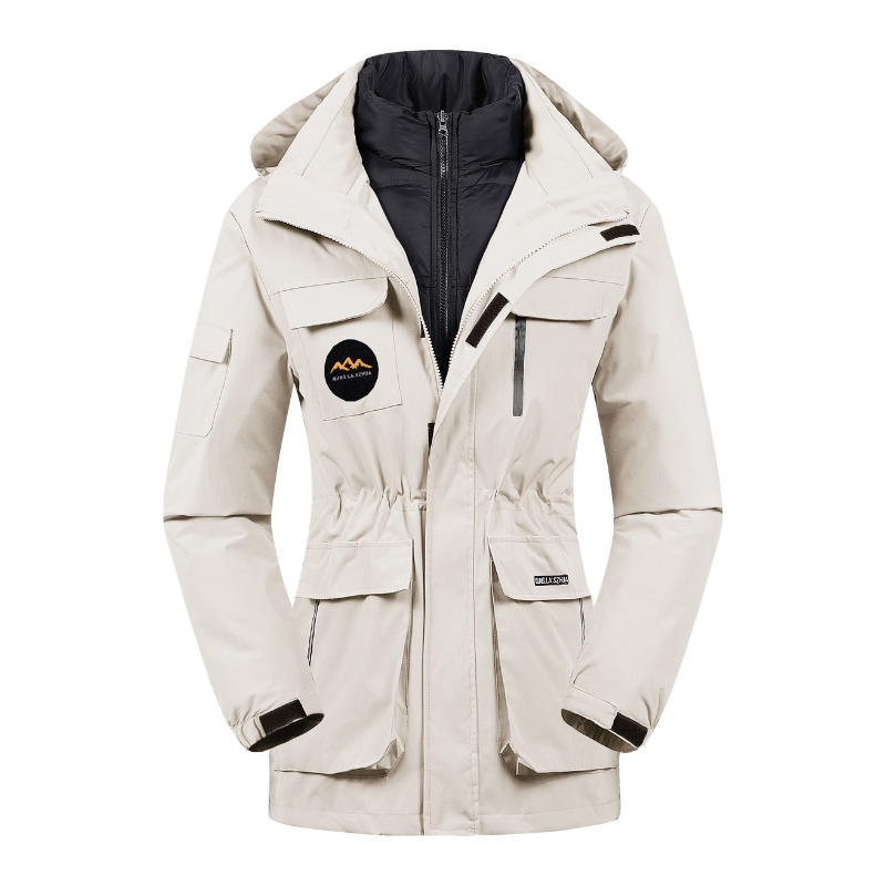 Women's utility ski jacket in neutral tone, structured silhouette with layering-friendly design for active winter wear