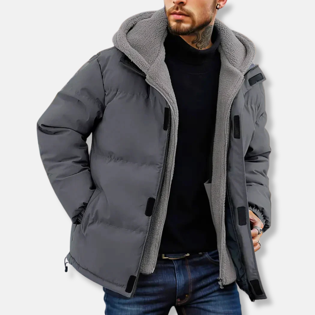 Men's navy quilted puffer jacket with fleece-lined hood, water-resistant finish for all-day warmth